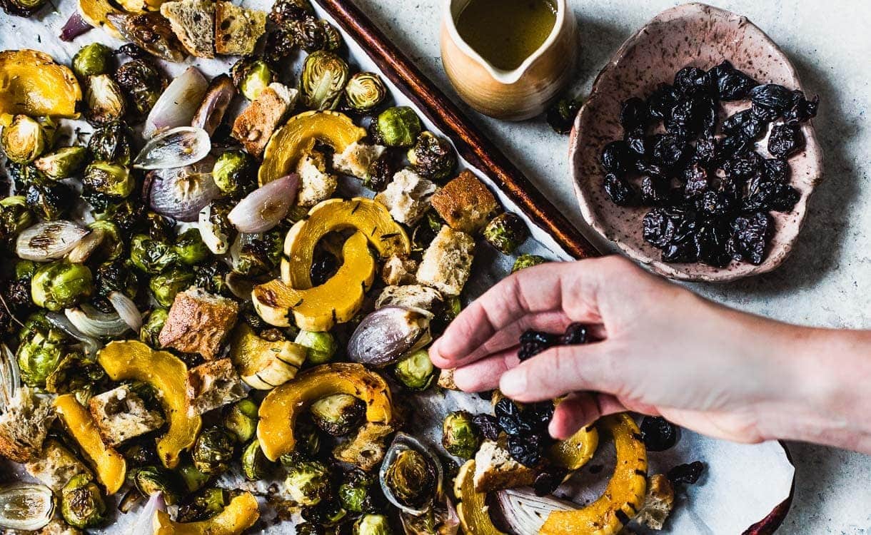 Vegetarian Sheet Pan Stuffing with squash, brussels sprouts, and dried tart cherries