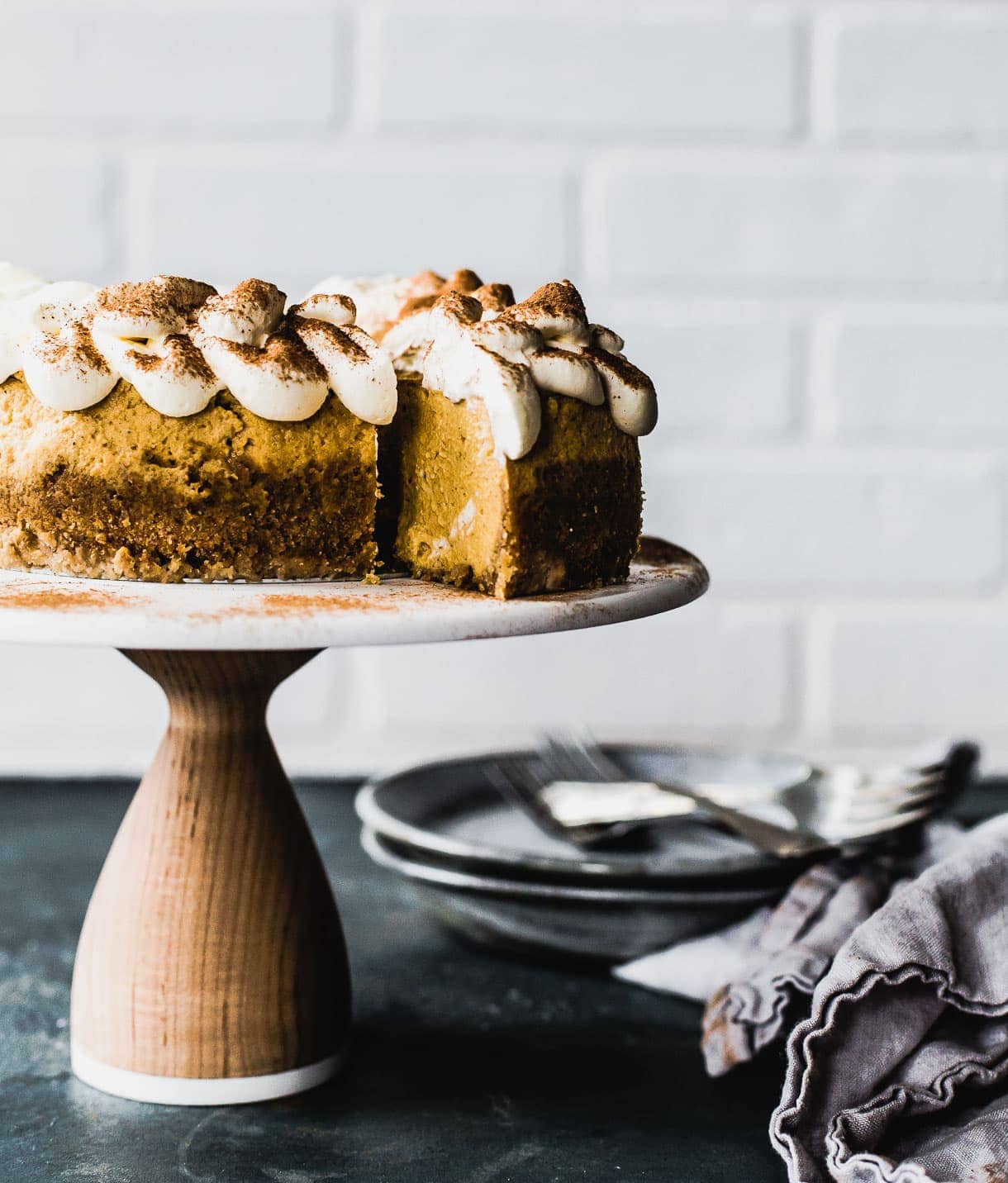 Cinnamon Dusted Pumpkin Cheesecake with gluten free crust