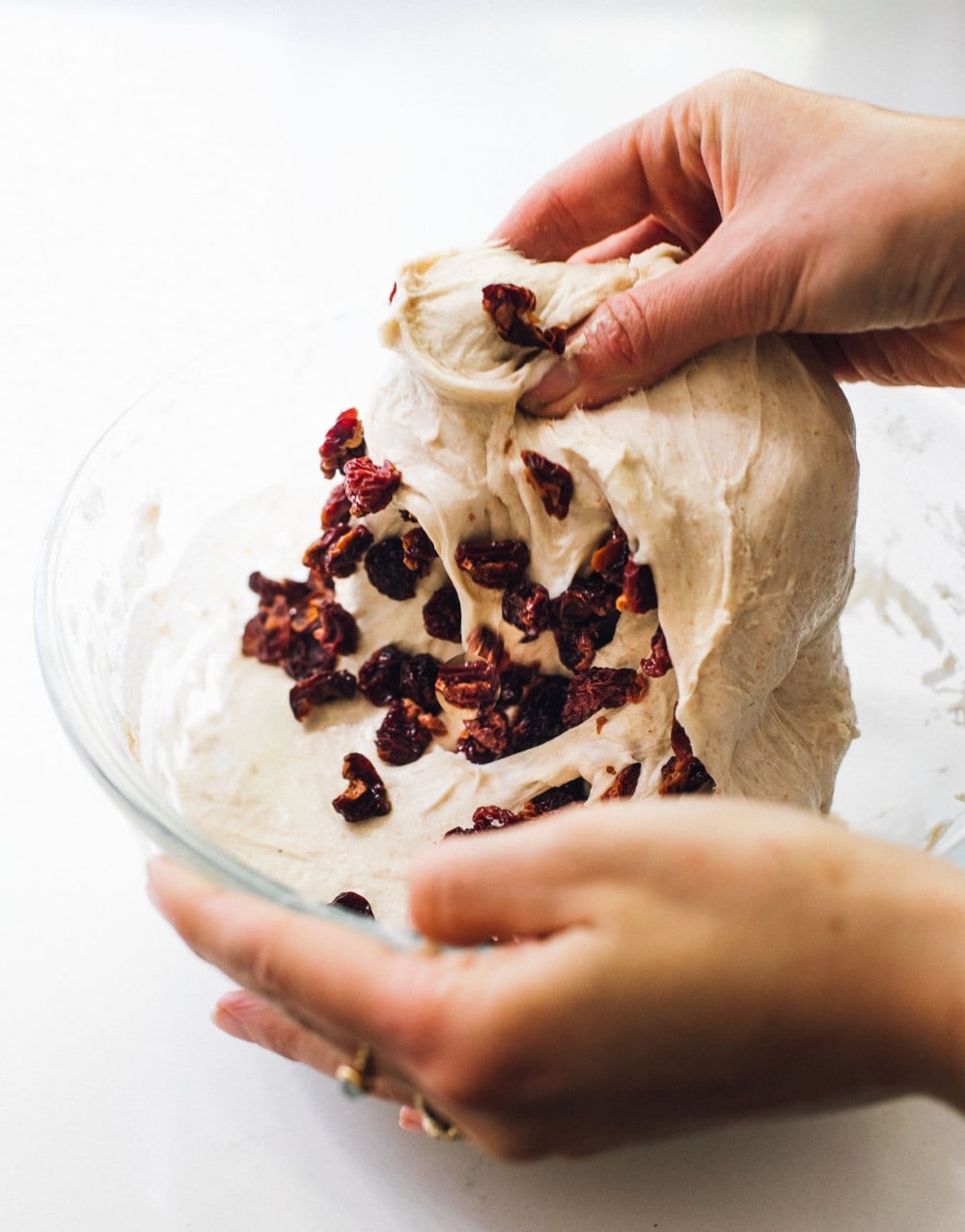 folding tart cherries into sourdough bread