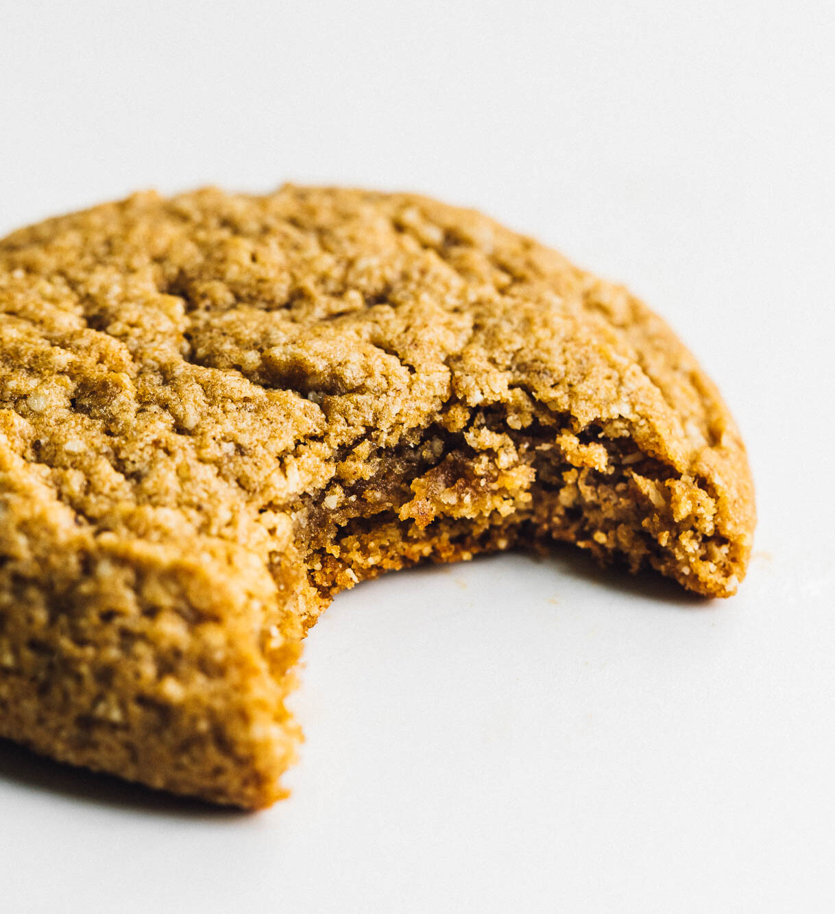 gluten free pumpkin cookie with a bite taken out of it.