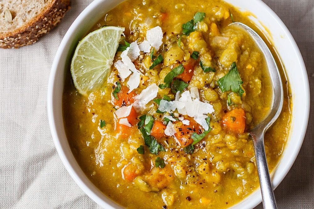 split pea soup with sweet potatoes in a white bowl