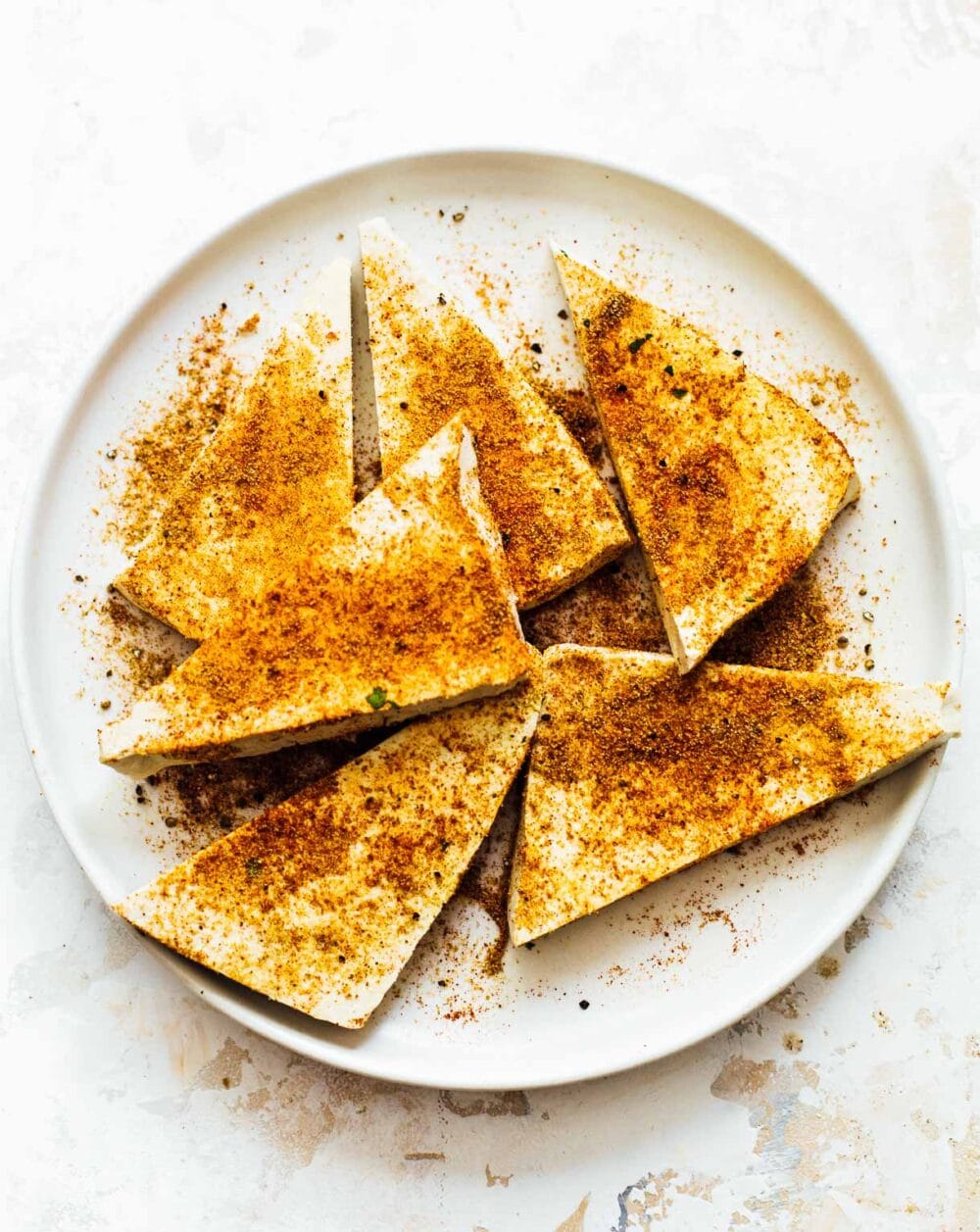 tofu with spices on it, uncooked