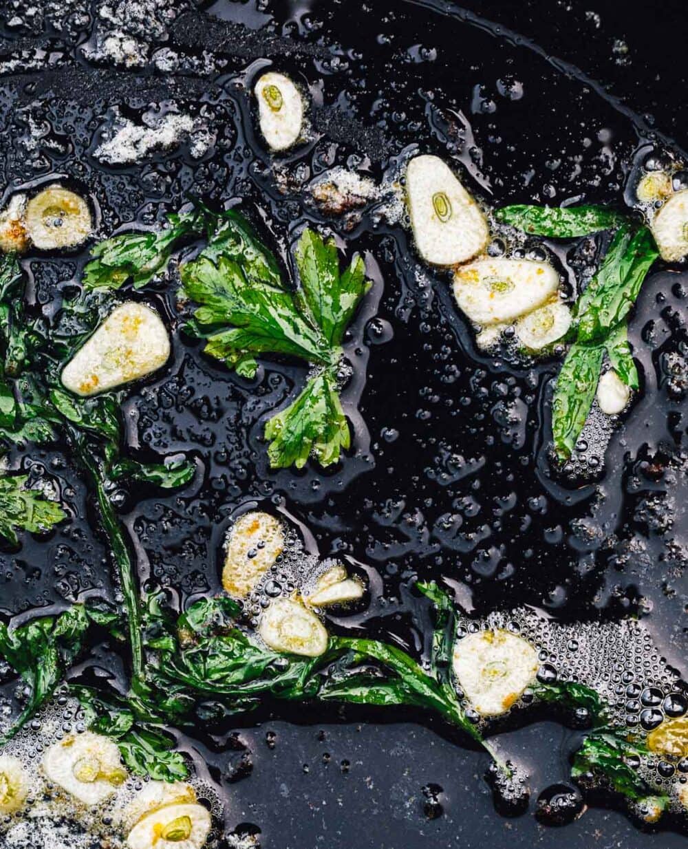 COOKING GARLIC BUTTER ON CAST IRON SKILLET