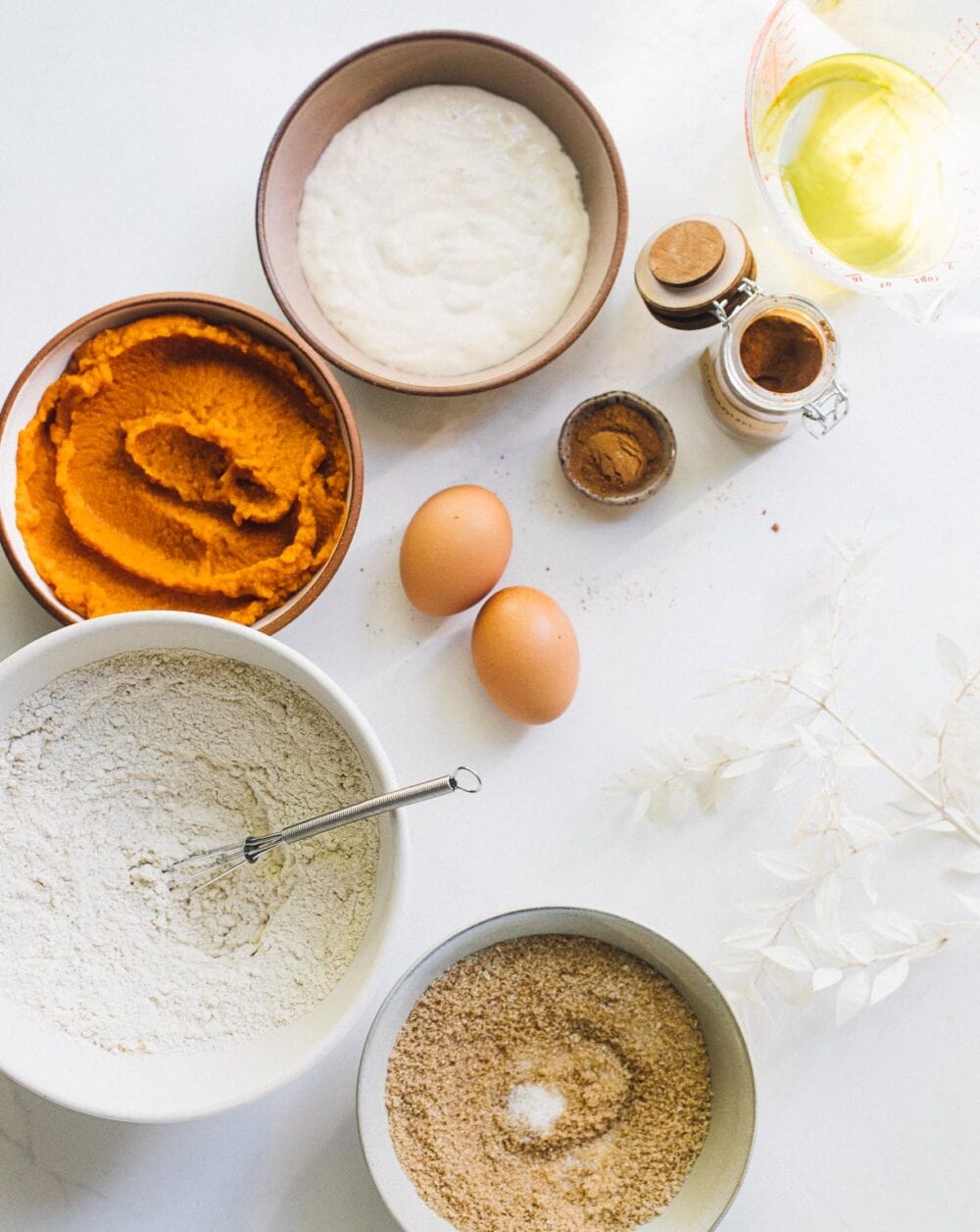 ingredients for sourdough discard pumpkin bread on white surface