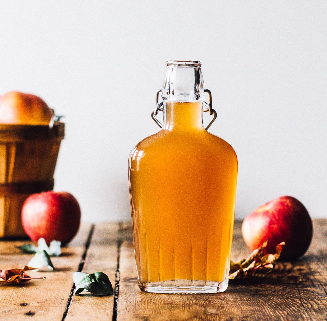 apple shrub syrup in a glass container