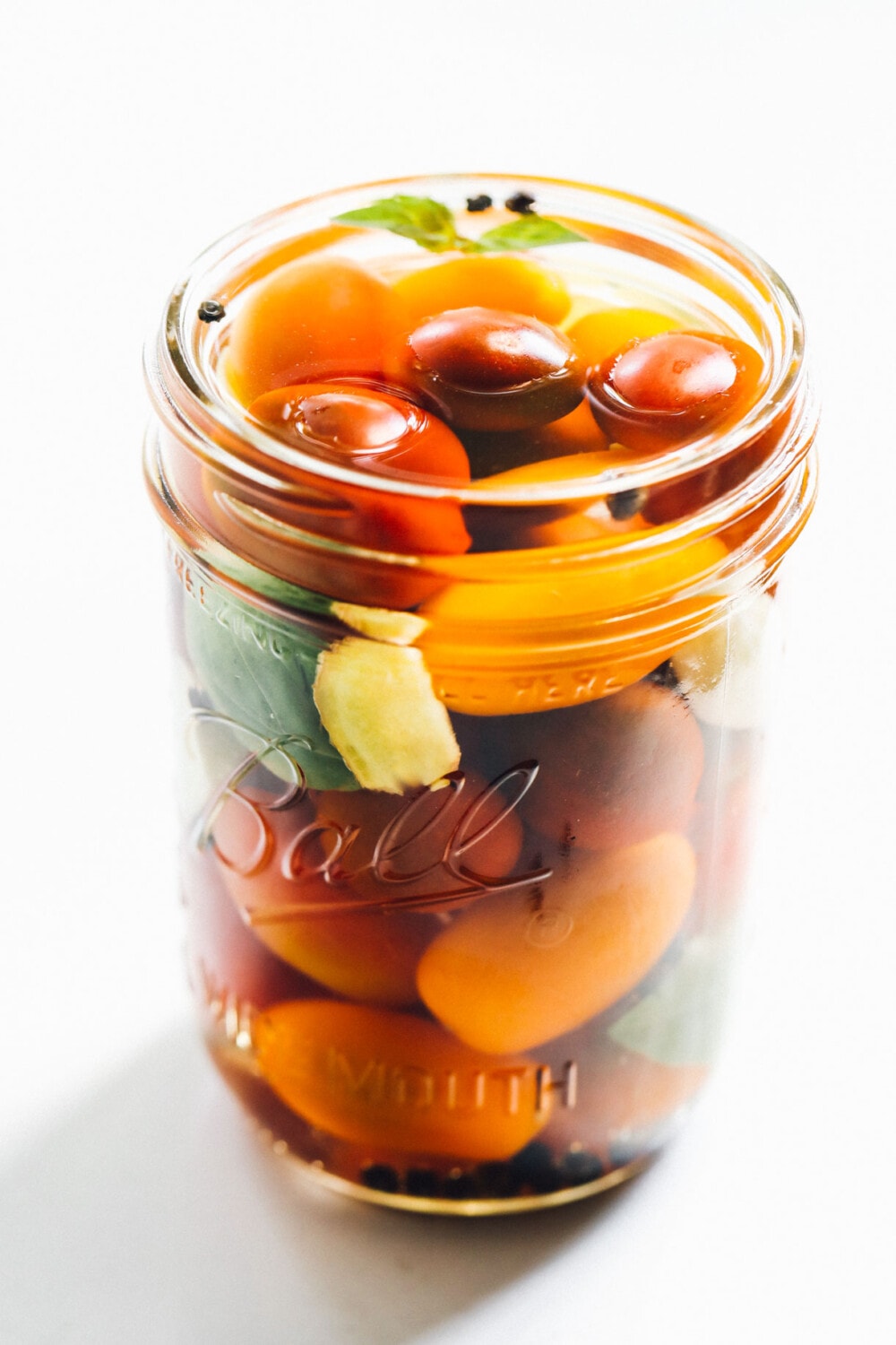 pickled cherry tomatoes in a glass jar