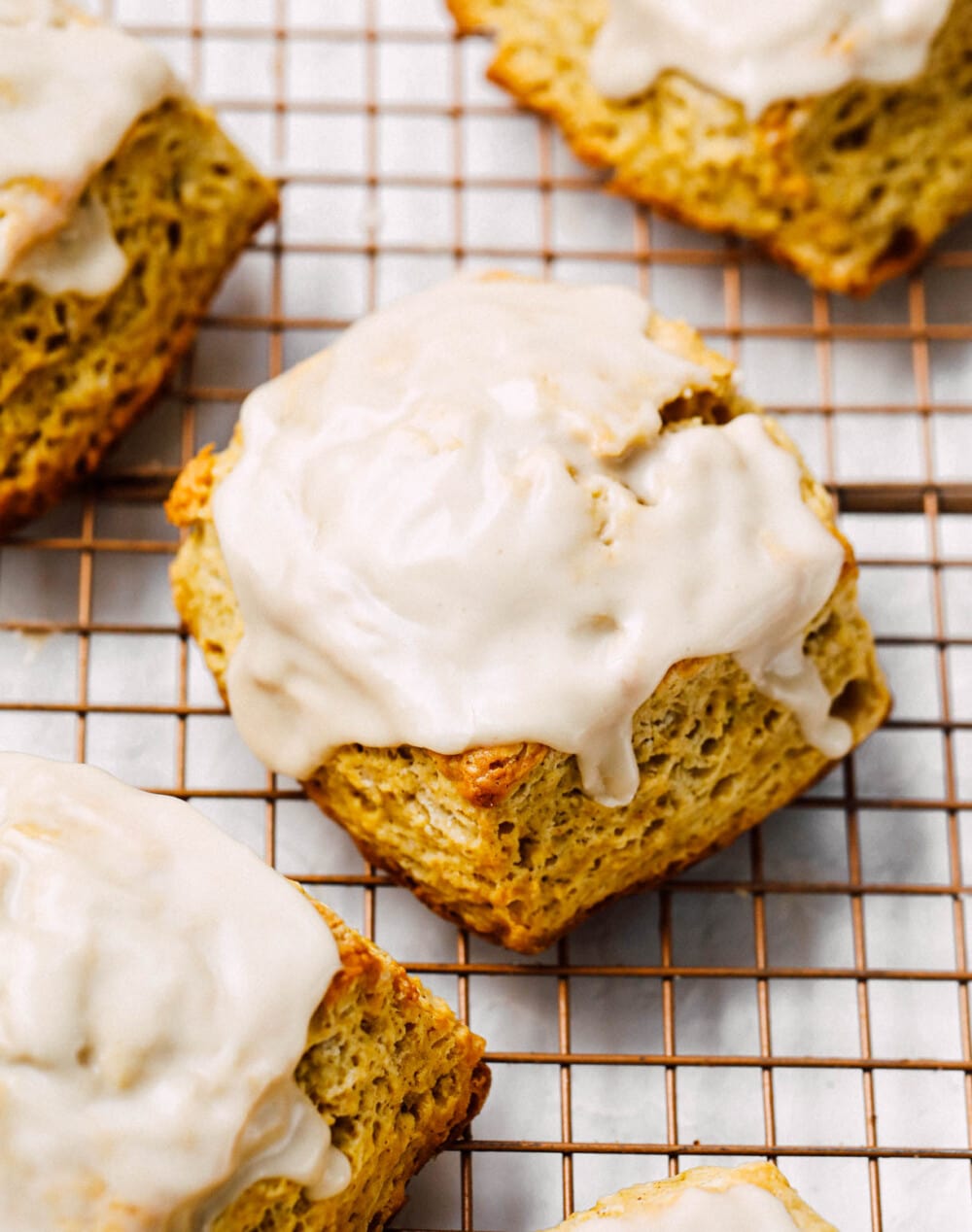 sourdough scones with maple glaze on cooling rack