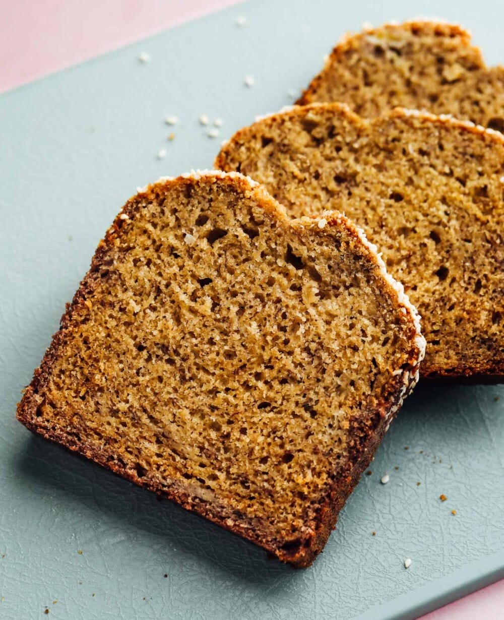 sourdough discard banana bread on teal cutting board