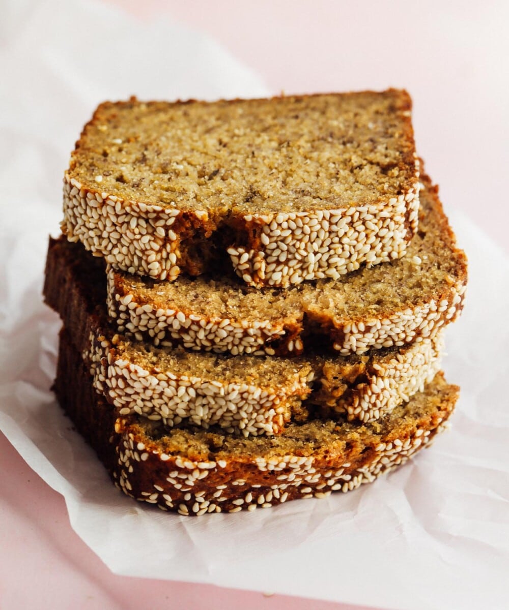 sourdough discard banana bread, sliced and on parchment paper
