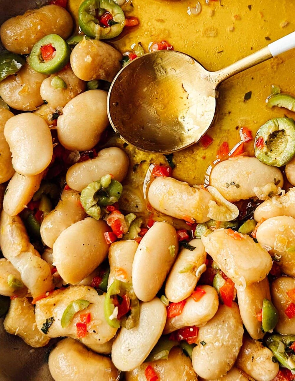 marinated giant white beans in skillet