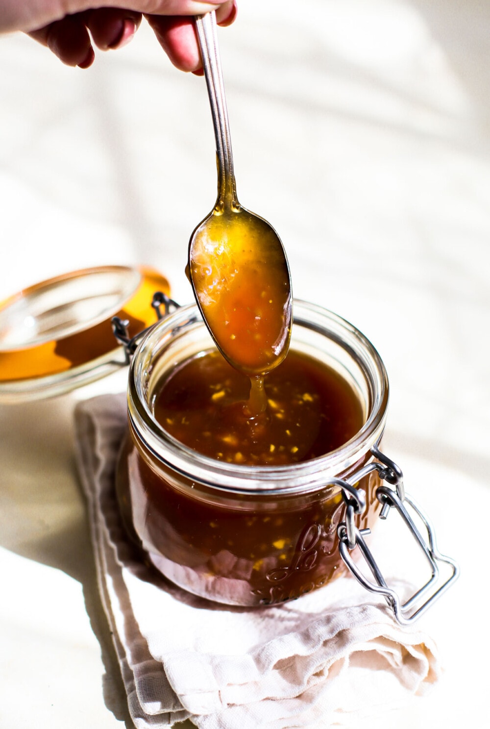 gluten free teriyaki sauce in a glass jar with spoon