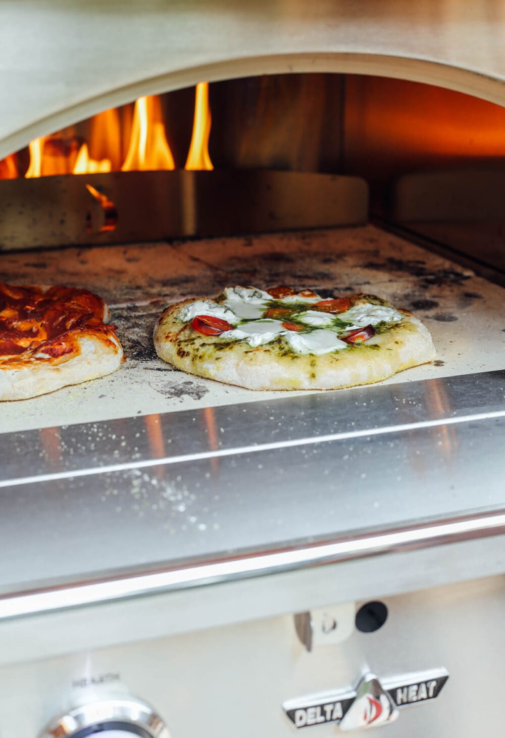 pizza cooking in a delta heat pizza oven