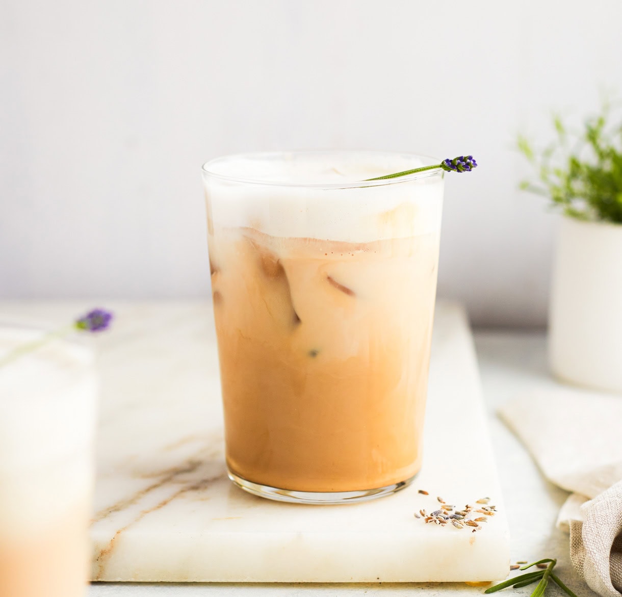 lavender iced latte on marble board