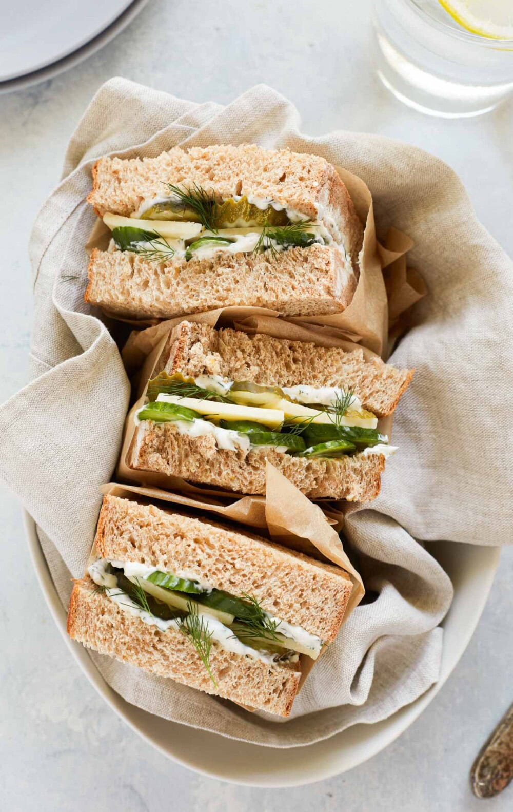 a tray of pickle sandwich halves.