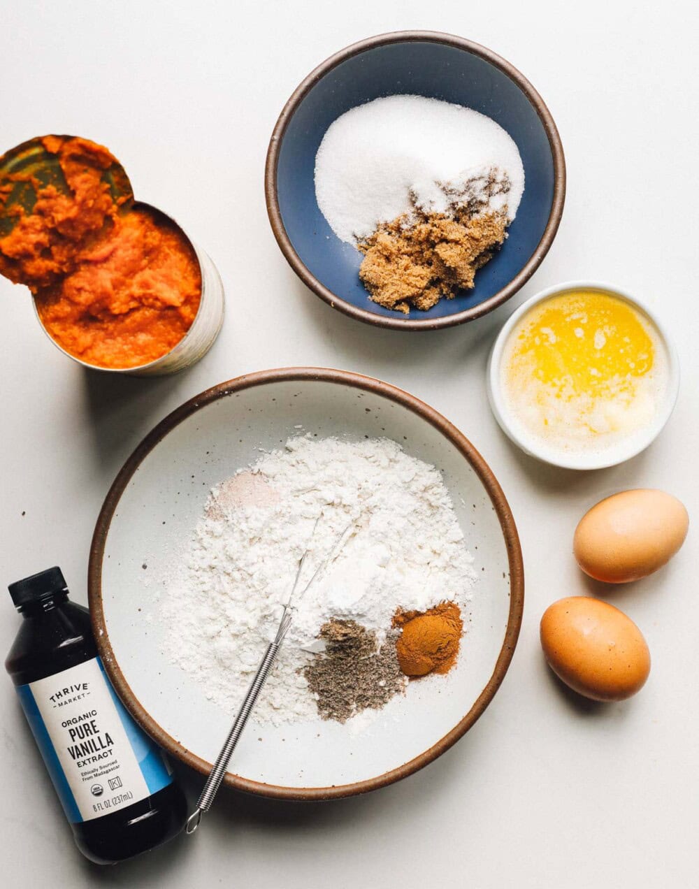 ingredients for gluten free pumpkin bars on a white backround
