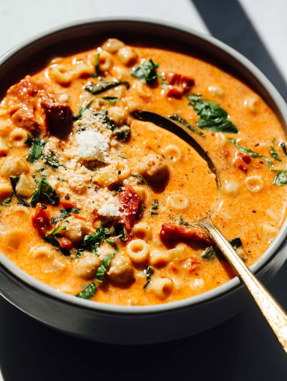 Hearty 30-minute chickpea soup with spinach and spices in a blue bowl.