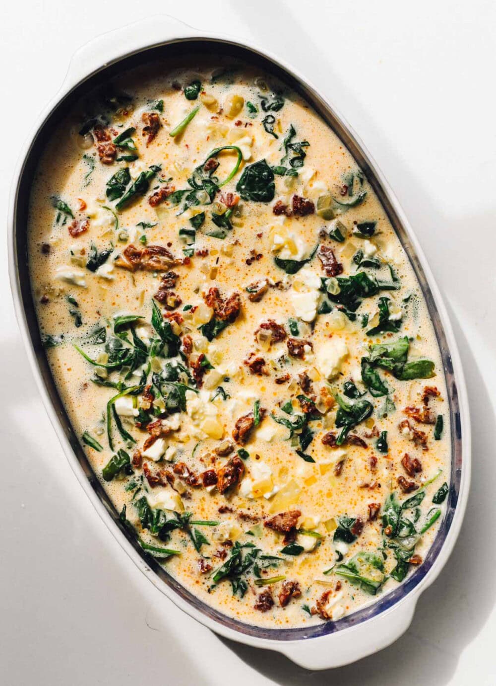 batter for cottage cheese egg bake in a glass mixing bowl