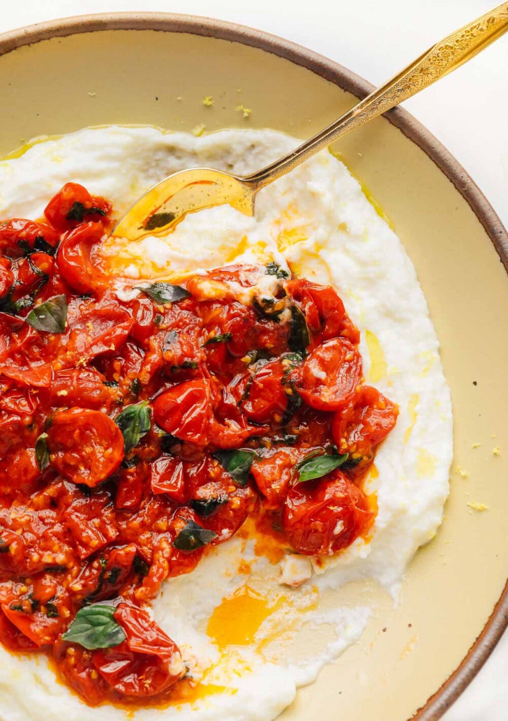 plate of whipped mozzarella with cherry tomatoes
