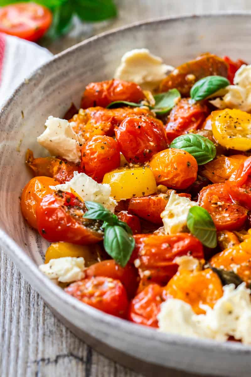 Roasted Cherry Tomato Caprese Salad in a pottery bowl